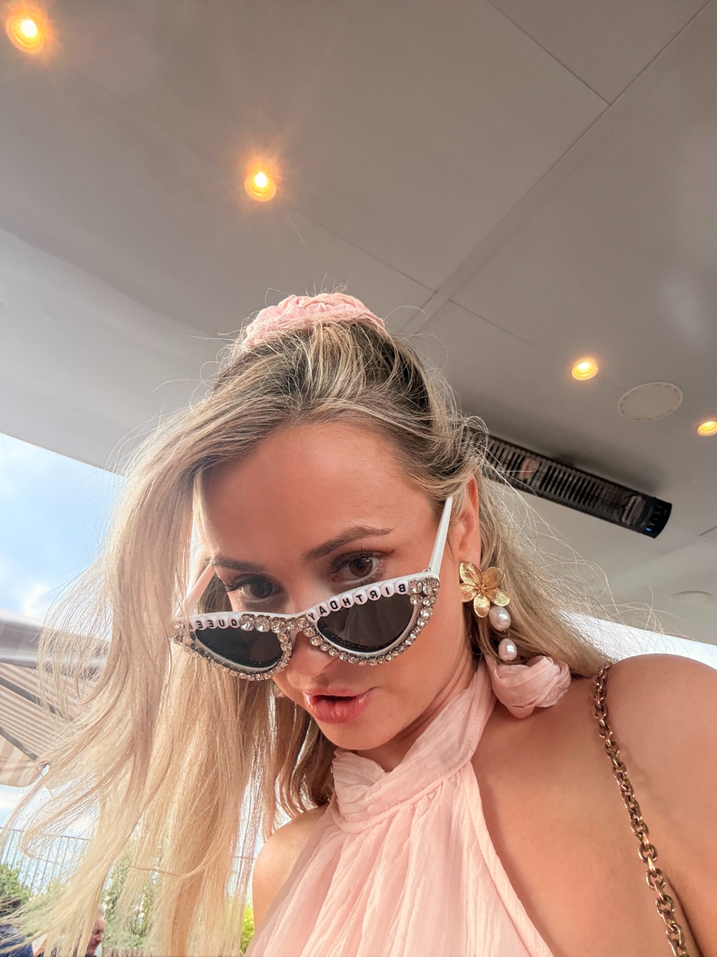 Guest wearing birthday queen sunglasses