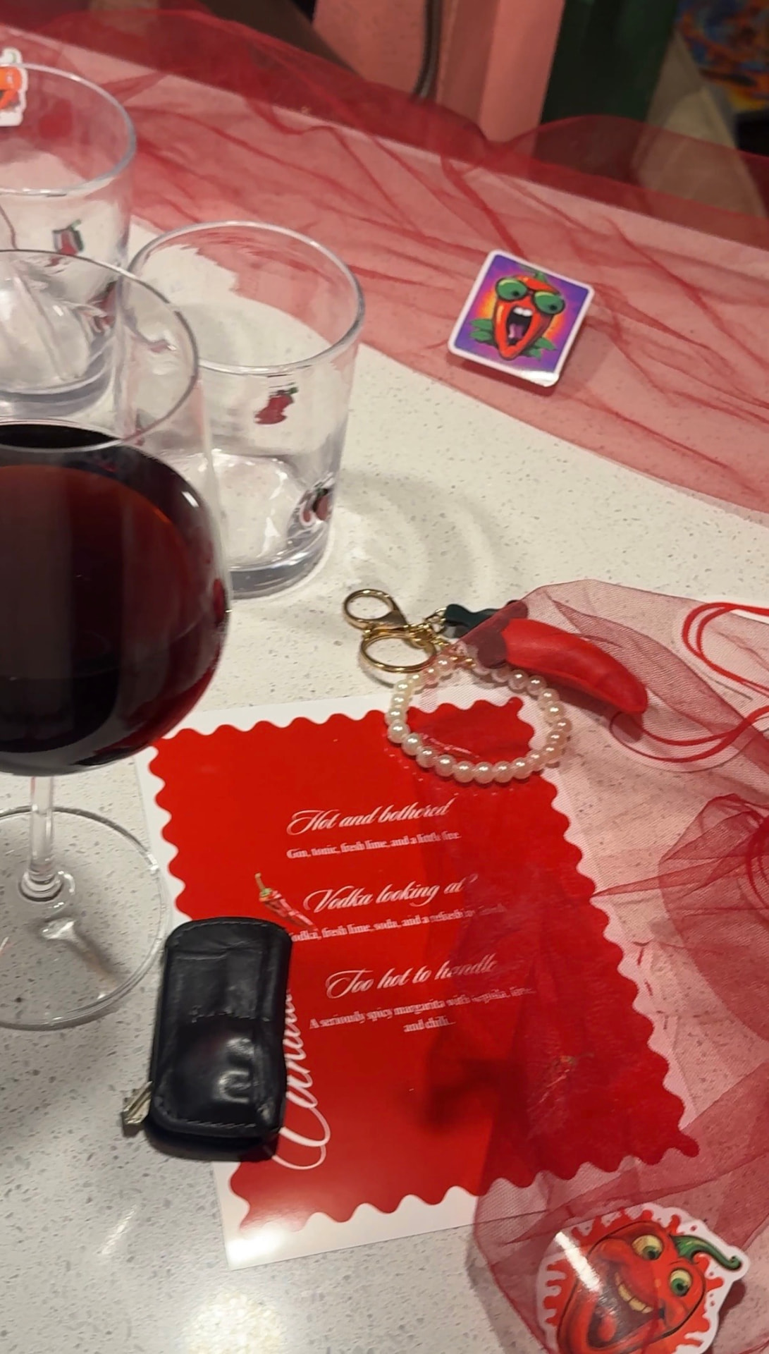 Red scalloped table styling with matching glassware